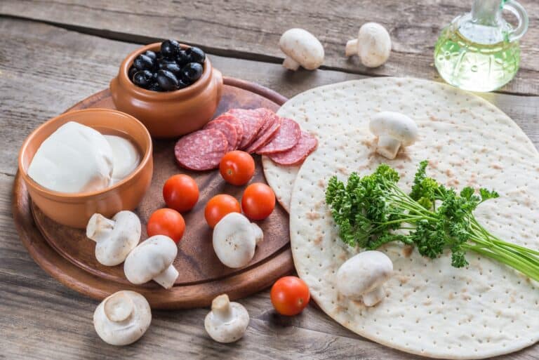 Ingredients for pizza on the wooden background